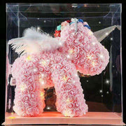 A beautiful forever rose unicorn figurine, handcrafted with soft pink artificial petals and a sparkling horn by vivaessencepet