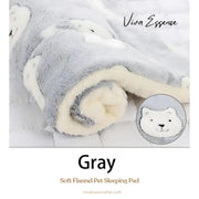 A small puppy sleeps on a cozy and washable pet sleeping pad, highlighting its soft flannel surface - vivaessencepet