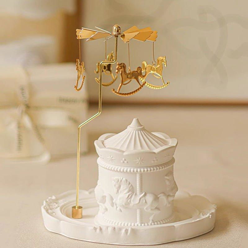 Intricate ceramic soy candle home decor featuring a delicate spinning gold carousel - vivaessencepet