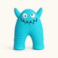 Turquoise monster-shaped dog chew toy with textured ridges