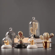 1. A matte ceramic cactus sculpture adding a serene, nature-inspired touch to a modern living room space by vivaessencepet