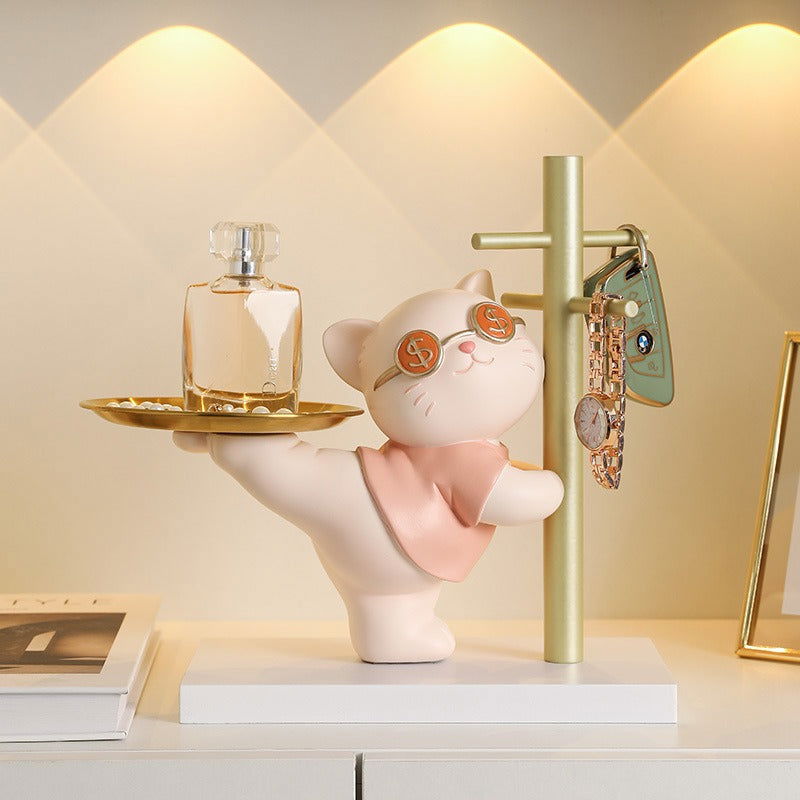 Modern kitty sculpture storage serving as a whimsical jewelry dish on a bedroom dresser - vivaessencepet