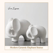 1. A set of large and small modern ceramic elephant statues, offering elegant home decor for any room by vivaessencepet