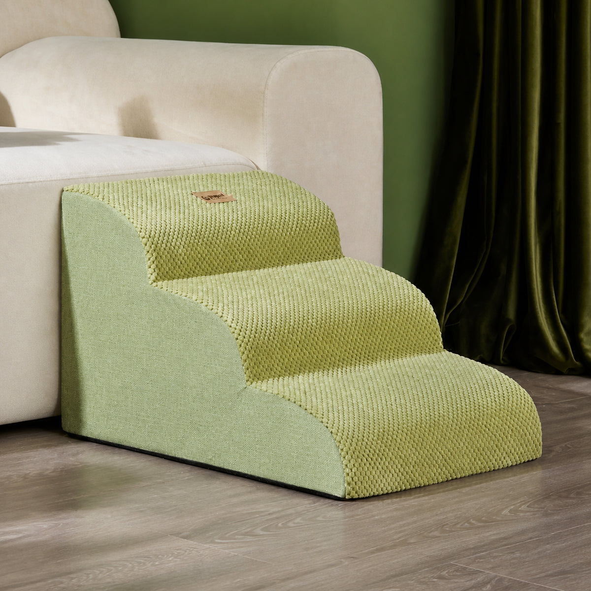 Green three-step non-slip dog stairs in a cream-sofa living-room scene.