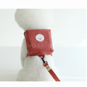 A small dog wears the Urban Pet Harness Backpack, a stylish 2-in-1 bag for hands-free city walks - vivaessencepet