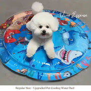 A happy Golden Retriever dog relaxes on the blue, water-filled pet cooling bed with a fun aquatic theme - vivaessencepet
