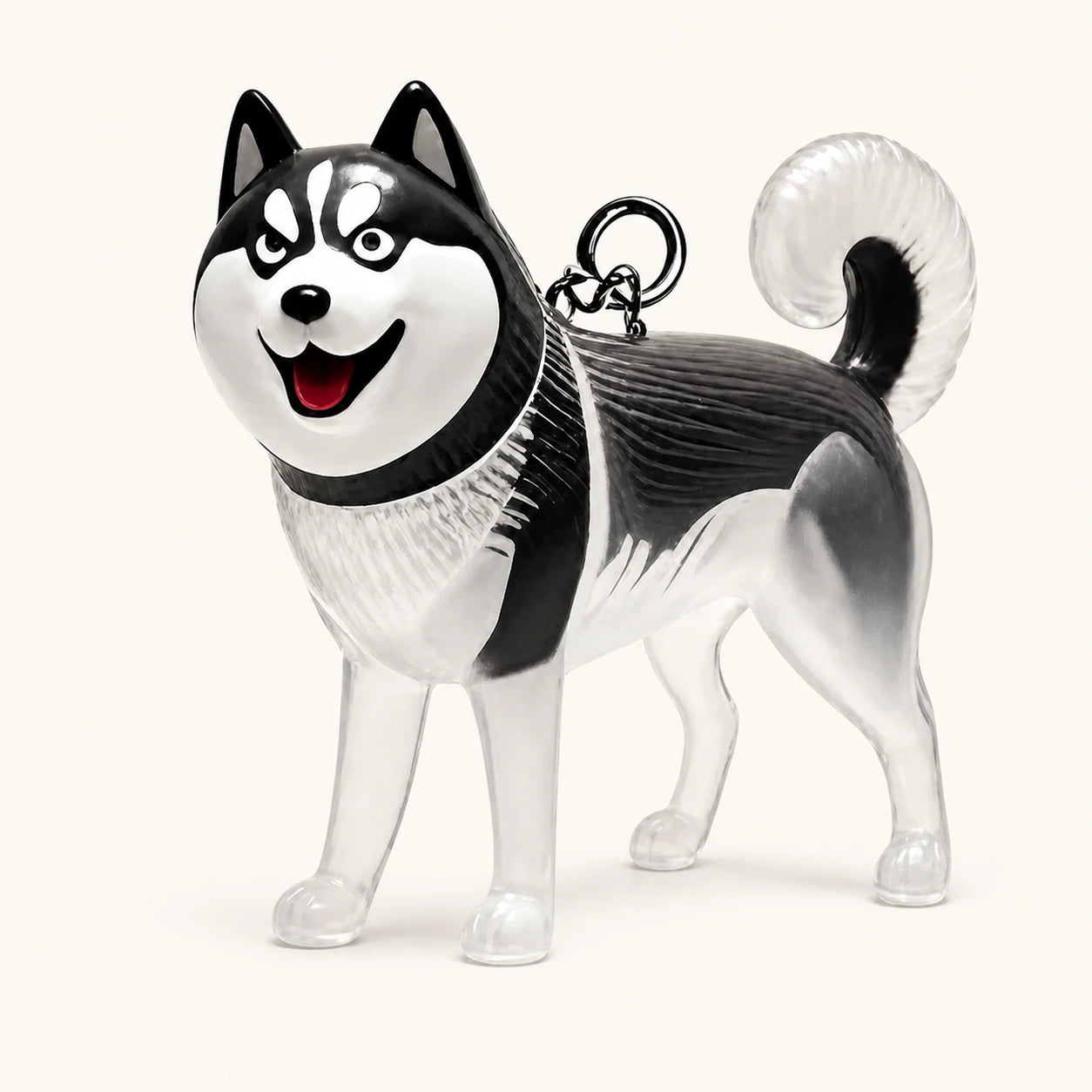 Nyckelring för pälsminne med huskymotiv och genomskinlig kapsel mot varm elfenbensfärgad bakgrund