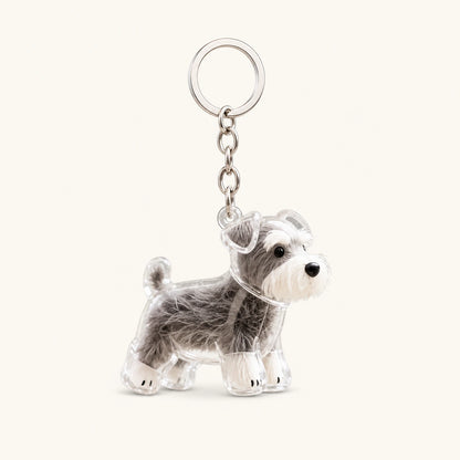 Schnauzer Standing pet fur keepsake keychain with clear capsule on a warm ivory background