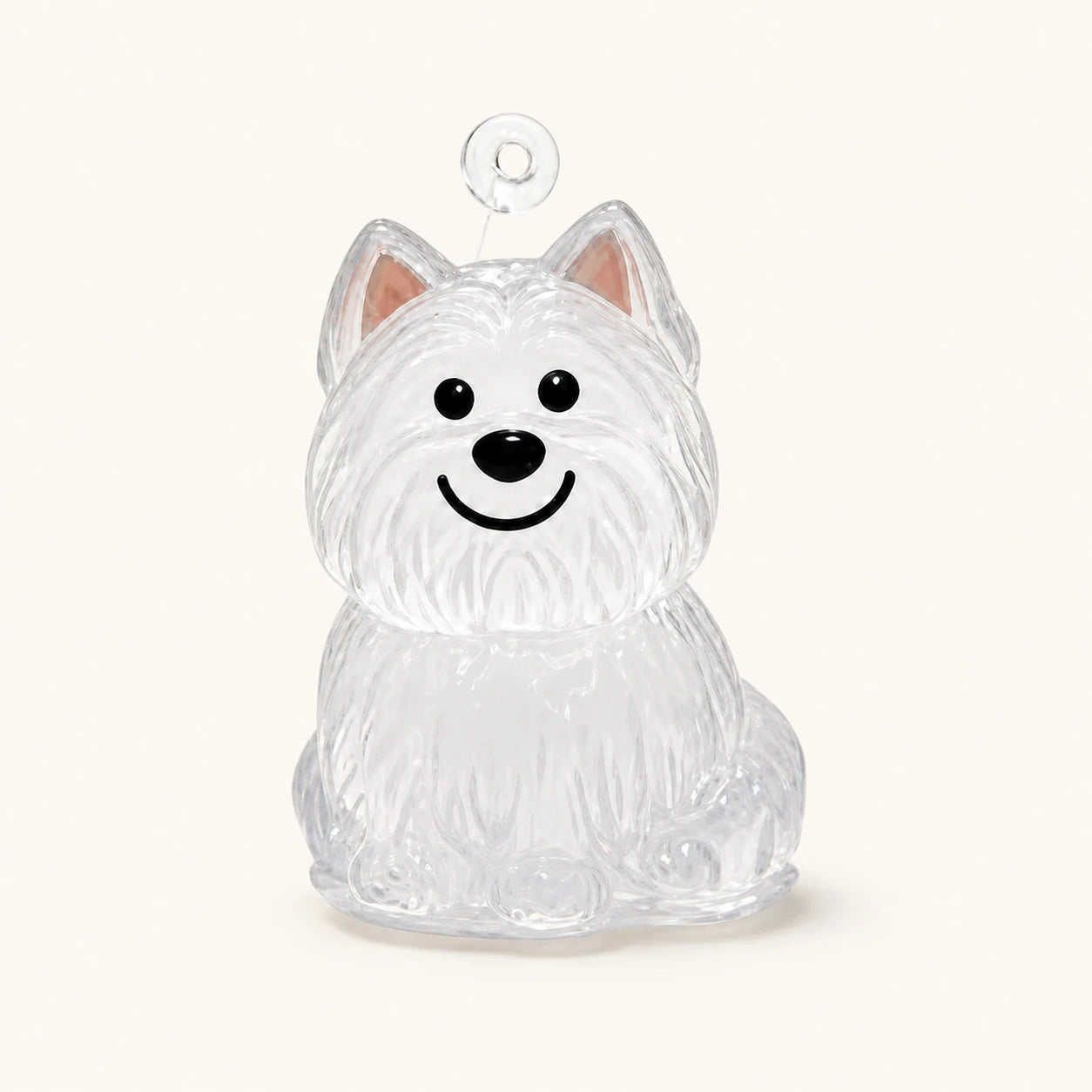 Nyckelring för pälsminne med west highland white terrier-motiv och genomskinlig kapsel mot varm elfenbensfärgad bakgrund