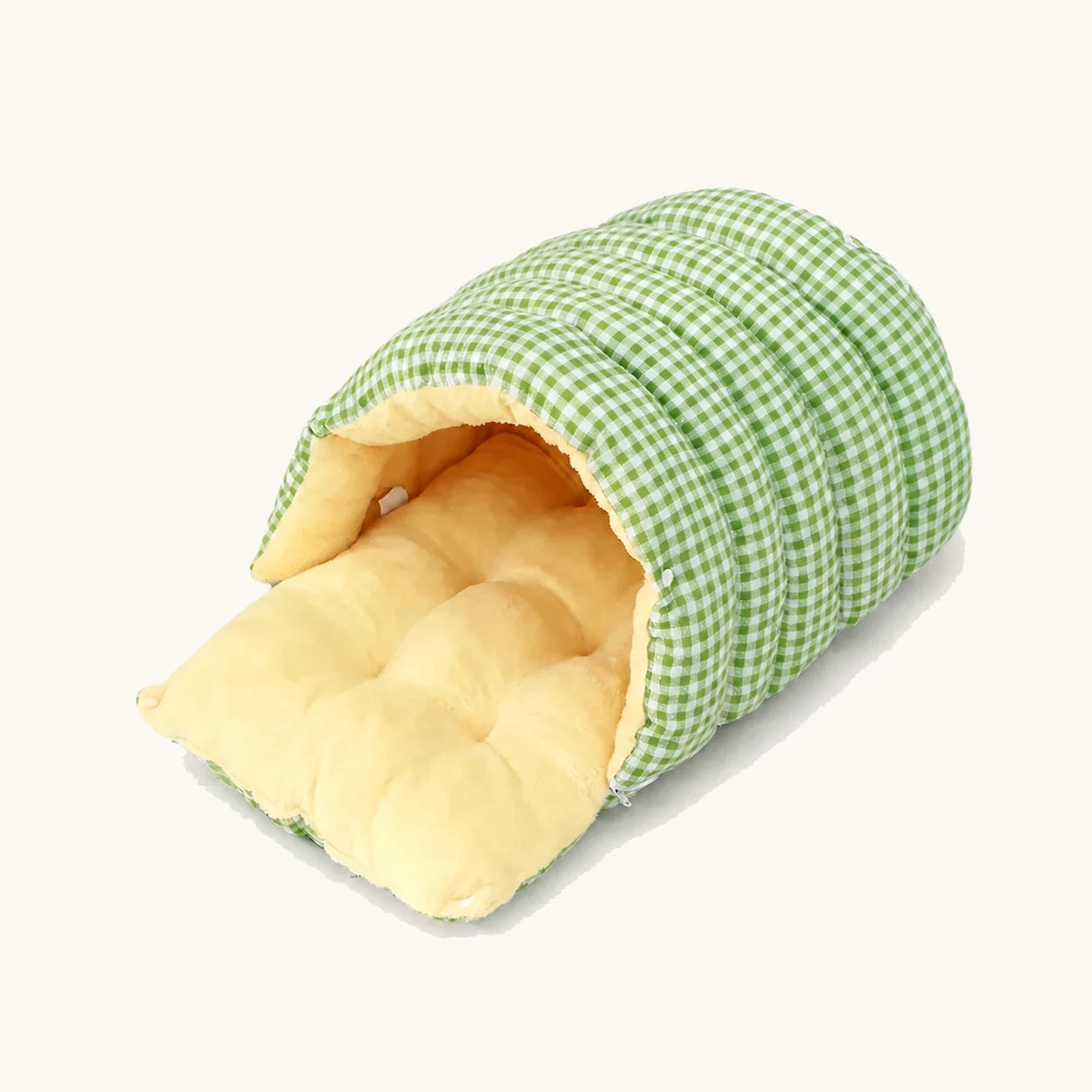 Knus grottenbed voor huisdieren met een groen ruitjespatroon en zachte pluche binnenkant