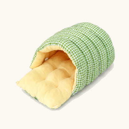 Cozy Cave pet bed with green gingham cover and plush interior