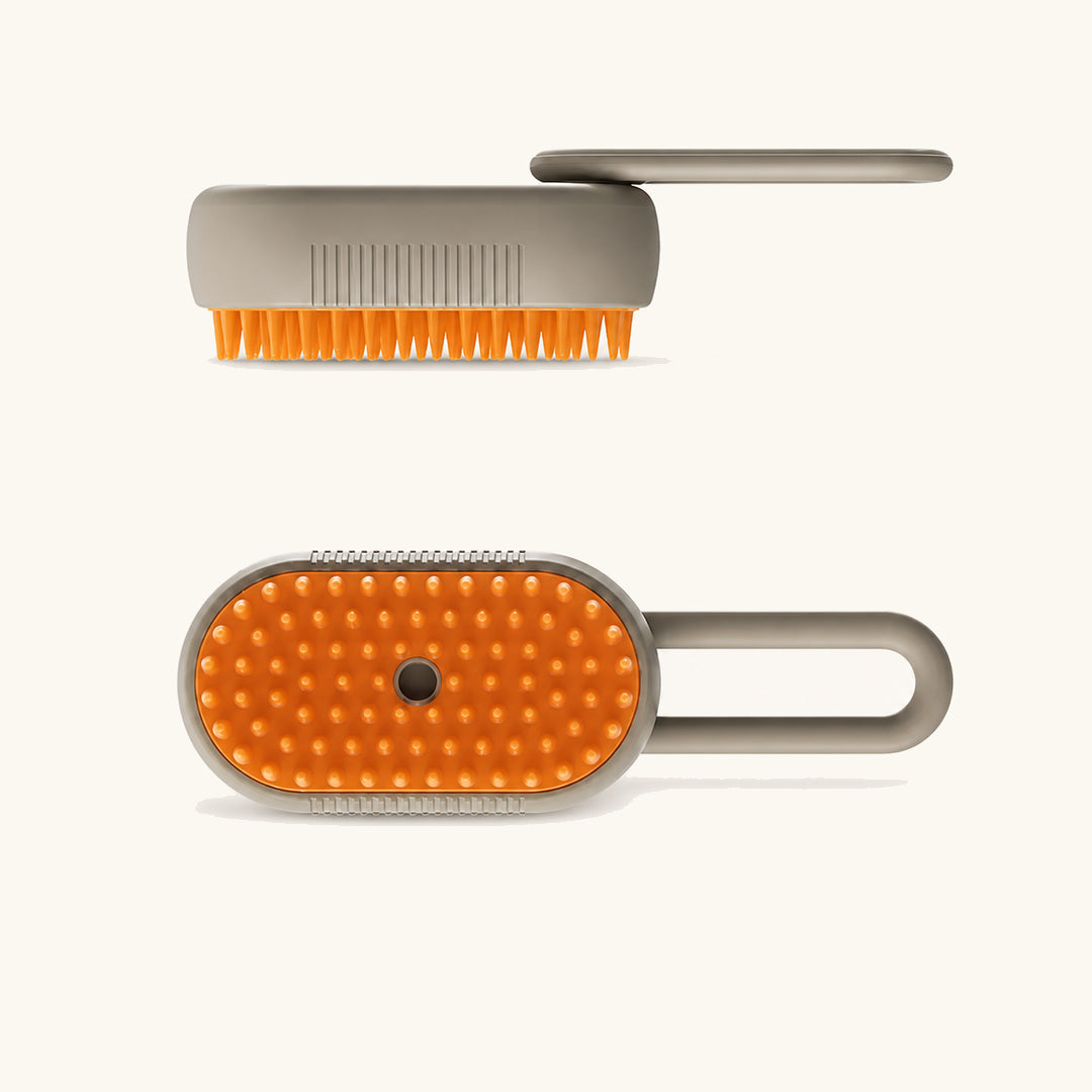 Cream spray-handle pet massage brush shown from side and bristle views